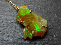 honeycomb welo opal pendant gold opal necklace, honeycomb opal necklace gold opal pendant, golden opal crystal pendant, unique gift for her // Stunning honeycomb opal pendant, set in solid 24k yellow gold. // Gorgeous gift for a beloved person or just to keep for yourself. Opal is an October birthstone, and a unique gift for your 12th, 14th or 24th wedding anniversary. // Awesome when worn alone or layered with other necklaces. > overall 25mm (0.98 inches) long pendant including the bail > Unique Gold Opal Necklaces, Yellow Gold Ethiopian Opal Necklace For Gift, Gold Ethiopian Opal Pendant Necklaces, Ethiopian Opal Pendant Jewelry As A Gift, Ethiopian Opal Pendant Jewelry For Gifts, Handmade Yellow Gold Jewelry With Ethiopian Opal, Gold Ethiopian Opal Pendant Necklace, Gold Ethiopian Opal Jewelry For Gift, Unique Ethiopian Opal Necklace Gift