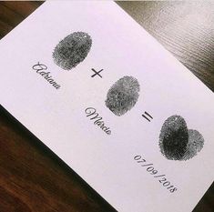 a close up of a paper with two finger prints on it