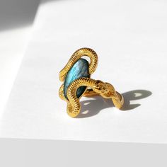 This beautiful ring is made in Sterling Silver and coated with a thick layer of 24K Yellow Gold to a Gold Vermeil thickness and set with a natural Labradorite. 24K Gold Vermeil jewelry is not only hypoallergenic, but it also does not tarnish.  Your ring is meticulously handcrafted and hand-polished to perfection. It is made to last a lifetime with proper care. This is a unique piece of minimalist jewelry for everyday wear.  Please note: Due to the one-of-a-kind nature of the gemstone, exact colo Elegant Gold Labradorite Ring, Elegant Gold Rings With Labradorite, Unique Gold Labradorite Rings, Yellow Gold Labradorite Ring For Gift, Gold Labradorite Gemstone Rings, Gold Rings With Labradorite Gemstone, Gold Labradorite Rings For Anniversary, Luxury Gold Snake Ring With Gemstone, Unique Gold Moonstone Open Ring