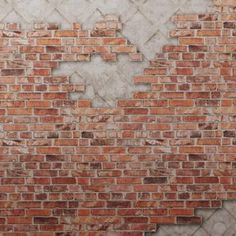 a brick wall that has been torn down and is being used as an art piece