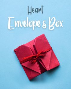 an origami envelope and box on a blue background with the words heart envelope and box