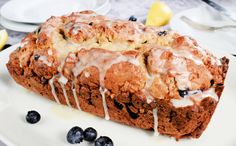 a loaf of lemon blueberry bread on a plate