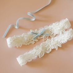 Beautiful and lovely garter set made of ivory color embroidery flower lace with soft ivory stretch lace. There is a light blue ribbon bow on the keepsake garter only. Soft and warm.  Please choose your thigh size. Please feel free to contact me for custom orders of different colors/sizes. Your garter will ship in a lovelike gift box.  ♥ How to measure garter size Wrap one end of the flexible measuring tape around your upper thigh. The garter is generally worn 3 to 4 inches above the knee. Please Garter Set Wedding, Lace Wedding Garter Set, Lace Wedding Garter, Wedding Toss, Wedding Garter Blue, Light Blue Ribbon, Wedding Garter Lace, Wedding Garter Set, Something Blue Wedding