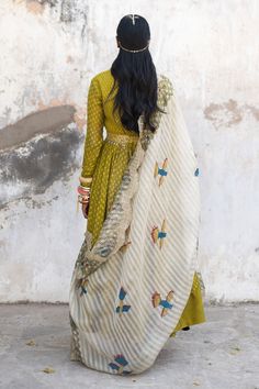 Green anarkali with all-over kalamkari print, pintucks at the yoke and leaf neckline. Comes with ivory printed dupatta and belt.
Component: 3
Printed, Embellished
Neckline: Leaf
Sleeve Length: Full
Fabric: Chanderi
Color: Green
Printed dupatta
Scallop edged dupatta
Embellished belt with coin tassels - Aza Fashions Festival Lehenga With Printed Motifs And Straight Kurta, Designer Cotton Silk Anarkali Set With Printed Motifs, Diwali Chanderi Anarkali Set With Printed Motifs, Chanderi Anarkali Set With Printed Motifs For Diwali, Designer Chanderi Anarkali Set With Printed Motifs, Festive Chanderi Lehenga With Printed Motifs, Floor-length Chanderi Kurta With Printed Motifs, Anarkali Chanderi Lehenga With Printed Motifs, Anarkali Tussar Silk Set With Traditional Drape