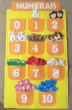 a bulletin board with numbers and animals in them on the floor for kids to use