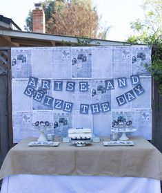 a table topped with cake next to a fence