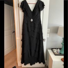 Beautiful Long Black Size 14 Jovani Gown Never Been Altered And Only Worn Once For 2 Hours. Original Price Was $600. Smoke Free And Pet Free Clean Home. Happy Shopping! Black Formal Gown With Ruffles, Black Ruffled Gown For Formal Occasions, Elegant Formal Mother Of The Bride Dress With Ruffles, Black Maxi Mother Of The Bride Dress For Wedding, Formal Black Evening Dress With Ruffles, Elegant Black Maxi Length Mother Of The Bride Dress, Elegant Black Floor-length Mother Of The Bride Dress, Black Floor-length Mother Of The Bride Dress, Formal Black Maxi Mother Of The Bride Dress