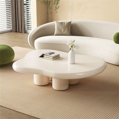 a white couch and table in a room