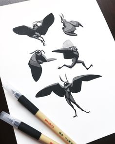 an image of some cartoon birds on a piece of paper with marker and pen next to it