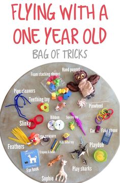 a poster with toys and words on it that says flying with a one year old bag of tricks