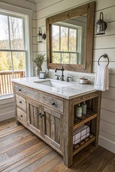 Transform your bathroom with a farmhouse-inspired vanity that combines rustic reclaimed wood, vintage hardware, and charming country-inspired details. Bring warmth and character to your space! Bathroom Vanity Trends, Dresser Vanity Bathroom, Western Bathroom Decor, Pallet Bathroom, Bathroom Vanity Ideas, Rustic Farmhouse Bathroom, Farmhouse Vanity, Bathroom Vanity Designs