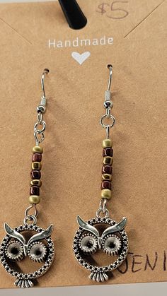 The dangle earrings feature a row of brown and gold colored glass beads (3mm) with a silver owl charm at the end. The earrings are 1 3/4" long, the drop is total of 2 3/8". Acrylic Nails Almond Shape, Handcrafted Ornaments, Silver Owl, Almond Acrylic Nails, Christmas Favorites, Almond Shape, Nails Almond, Be My Valentine, Holiday Collection