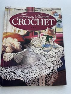 a book on crochet sitting on top of a wooden table