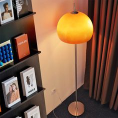 a lamp that is next to a book shelf