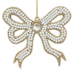 an ornament shaped like a bow with pearls