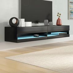 an entertainment center in a living room with white walls