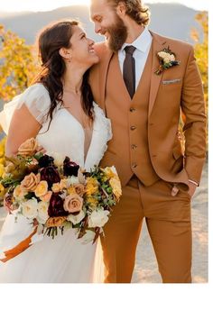 a bride and groom smile at each other