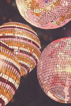 three disco balls are shown in this artistic photo, with many colors and patterns on them