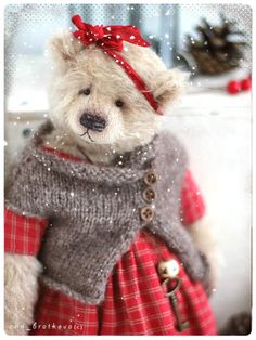 a teddy bear wearing a sweater and skirt