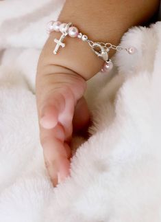 "Personalized Pink Pearl Bracelet for Newborn, Infant, Baby, or Little Girl. This keepsake gift is created with 5mm pink Swarovski crystal pearls, pink Swarovski crystals, a sterling silver heart-shaped initial, 2 sparkling sterling silver stardust spacers, and a heart shaped lobster clasp with a 1/2\" \"Grow-With-Me\" extender chain. You also have your choice of one sterling silver charm, placed near the clasp. ALL metal components are sterling silver. (Star of David charm is silver plated) Arr Personalized Pink Rosary Bracelet For Baptism, Adjustable Pink Jewelry For Baptism, Handmade Pink Jewelry For Baptism, Pink Pearl Bracelet, Silver Initial Charms, Infant Baby Girl, Girl Bracelet