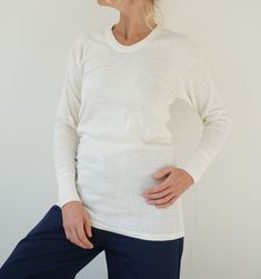 A must-have basic. Vintage cotton thermal in natural alabaster color. 100% cotton. Nice cuffs. Never used, deadstock item. In excellent condition. The perfect white tee. We currently have a small group of these available, each one is unique.  Measurements are taken flat. Fits like MEDIUM | Unisex* Shoulder to shoulder = 18 in / 46 cm Armpit to armpit = 19 in / 48 cm Sleeve length = 21 in / 54 cm Total length= 31 in / 79 cm Model is 5'6", 26" waist, 36" hip and wears a modern 2-4 Fit guide:  it's Alabaster Color, Perfect White Tee, Small Group, White Tee, Vintage Cotton, White Cotton, Cotton T Shirt, Belgium, Cotton Tshirt