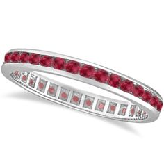 a white gold ring with red stones