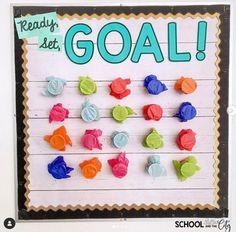 a bulletin board with colorful candy candies and words reading ready to let go goal