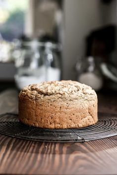 a loaf of bread sitting on top of a cooling rack with the words irish soda bread vegan / gluten - free