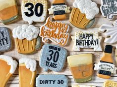 decorated cookies are arranged on a table for someone's 30th birthday party or celebration