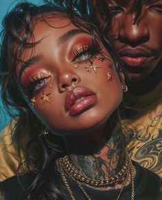 a man and woman with tattoos on their faces are looking at the camera while they both have gold stars painted on their eyes