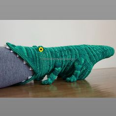 a stuffed alligator is sitting on the floor