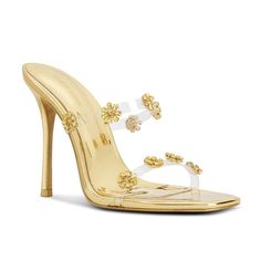 Step into elegance with FLORCITA metallic gold mules, where every step blooms with sophistication. Adorned with meticulously handcrafted crystal flowers atop clear PVC straps, these 100 mm heels redefine luxury with every stride Handmade Padded insole Leather outsole Color: Gold Material: Metallic PU, PVC and Crystals Heel height: 4 (100 mm) Comes with a dust bag Flowers Heels, Gold Mules, Modern Cinderella, Flower Heels, Pointy Pumps, Crystal Flowers, Crystal Heels, Glass Slipper, Gold Heels