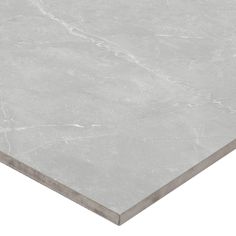 a white marble table top with grey veining on the edges and an angled edge