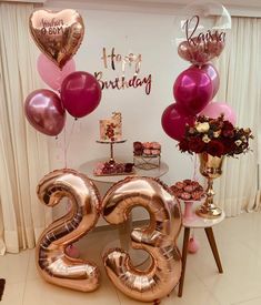 the table is decorated with balloons and decorations