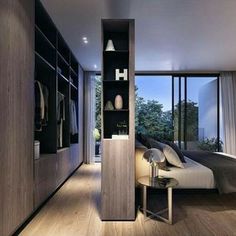 a bedroom with wooden floors and built - in shelving units, including a bed