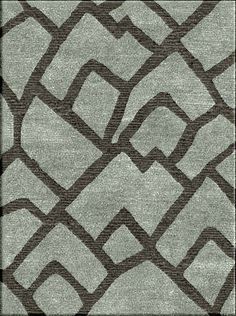 a rug with an abstract design in grey and brown colors on the bottom half of it