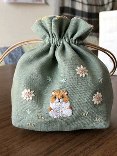 a small bag sitting on top of a wooden table