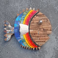 a colorful fish made out of wine corks