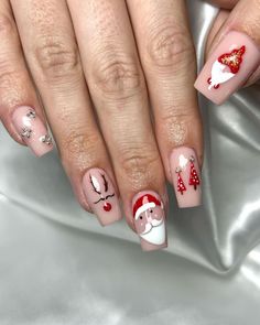 Delicate and detailed, these nails use a soft nude base to showcase holiday characters like Santa and a reindeer. Shiny ornaments, trees, and mini snowflakes add festive details without overwhelming the design. This look is perfect for those who want a subdued Christmas manicure that’s both cute and refined. Nails For Holiday, Mini Snowflakes, Santa Nail Art, Holiday Characters, Red Nails Glitter, Christmas Manicure, Santa Art, Red Polish