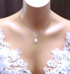 a close up of a mannequin with a necklace on it