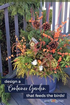 a container filled with flowers and plants on top of a wooden deck