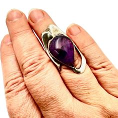 This Stunning Vintage Modernist Women's Ring By Hallmarked Is A Size 6.5 Sterling Silver Piece Adorned With A Beautiful Purple Amethyst Stone. Its Modernist Design Adds A Unique Touch To Any Outfit. Brand: Hallmarked Color: Purple, Silver Size: 6.5 Style: Modernist For: Women Material: Sterling Silver, Amethyst Features: Modernist Size: Womens Size 6 Condition: Pre-Owned Like New Vintage And Or Estate Jewelry Items. These Items Are Preowned Items And May Have Been Previously Worn. These Jewelry Polished Amethyst Ring For Anniversary, Polished Amethyst Anniversary Ring, Silver Luxury Amethyst Ring With Polished Finish, Luxury Silver Amethyst Ring With Polished Finish, Modern White Gold Amethyst Ring, Modern Amethyst Ring As Gift, Large Stone Gemstones For Formal Occasions, Modern Sterling Silver Amethyst Ring For Formal Occasions, Unique Amethyst Ring For Formal Occasions