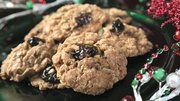 several oatmeal cookies on a blue tray