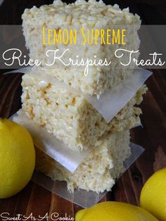 lemon supreme rice krispies treats stacked on top of each other next to two lemons