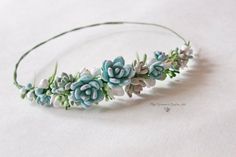 a headband with flowers and leaves on it