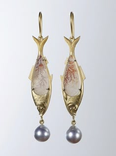 Available and ships immediately.   One of a kind herring fish earrings with semi-transparent dendritic agate bellies and silvery blue Akoya pearl drops in matte finished 18k yellow gold. The natural mineral inclusions in the agate resemble delicate pink coral, giving us a glimpse into the sea. The fish are hollow and designed to be light for comfortable wear.    Composition: Dendritic agate, Akoya pearls, 18k gold. Height and width including earwires: 67.8 x 13 mm (2.7 x 0.5 in) Dendritic agate Luxury Artisan Earrings, Luxury Artisan Handmade Earrings, Jewelry Smithing, Herring Fish, Jewelry Fabrication, Crab Jewelry, Sea Turtle Jewelry, Extraordinary Jewelry, Fish Earrings