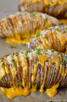 baked potatoes with cheese and parsley on top