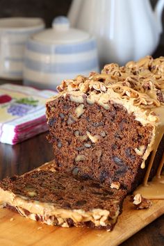 a loaf of cake sitting on top of a wooden cutting board