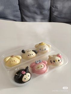 there are many small plastic animals in the container