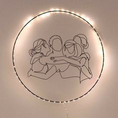 a drawing of three people hugging each other in a circle with string lights around it